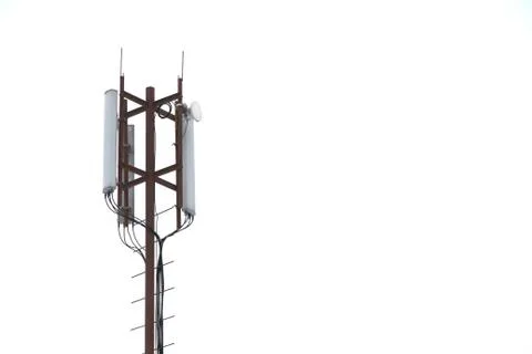 Base station mobile network antenna on a steel structure mast with a repeater Stock Photos