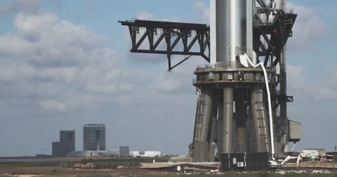 The base of the test pad for SpaceX Starship with the production facility Stock Footage 202451765