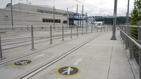 Base of the Tilikum Crossing bridge with a MAX light rail train going by. Stock Footage 64284454