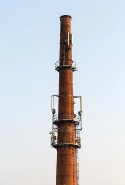 Base transceiver station on the old brick chimney Stock Photos