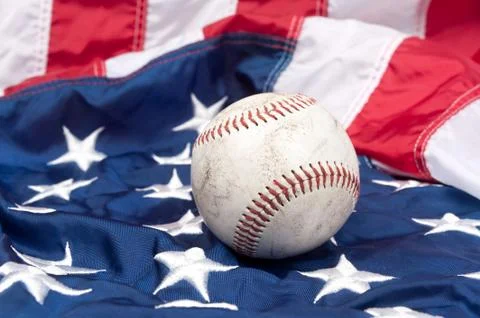 Baseball on american flag Stock Photos