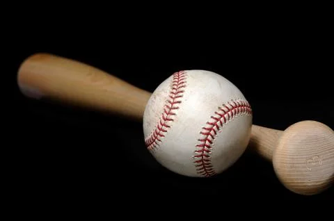 Baseball and bat on black Stock Photos
