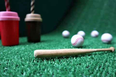 Baseball and bat on the  green grass with copy space Stock Photos
