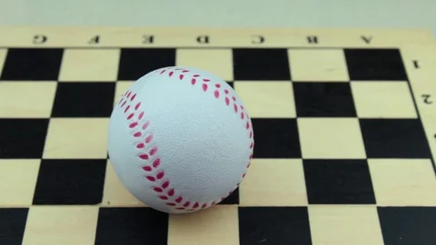 Baseball ball on a chessboard close up Stock Footage 78738268