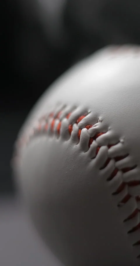 Baseball ball close-up rotating with smoke in studio slow motion, vertical view Stock Footage 281039550
