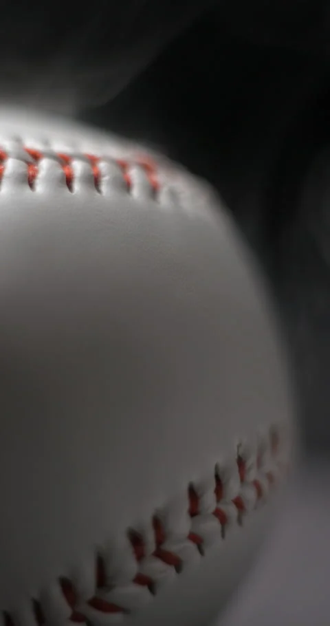 Baseball ball close-up rotating with smoke in studio slow motion, vertical view Stock-Footage 281039566