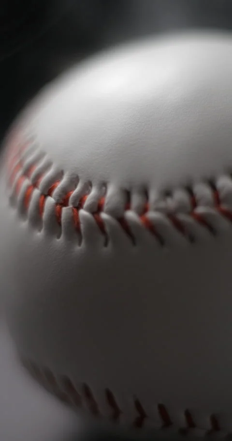 Baseball ball close-up rotating with smoke in studio slow motion, vertical view Stock-Footage 281039583