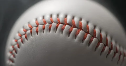 Baseball ball close up rotating in studio with smoke in slow motion Stock Footage 247513447