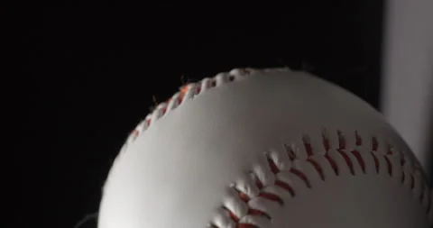 Baseball ball close up rotating in studio, vertical view Stock Footage 247513860