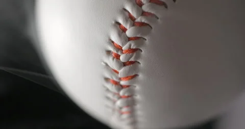 Baseball ball close up rotating in studio with smoke in slow motion, vertical Stock Footage 247513951