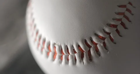 Baseball ball close up rotating in studio with smoke in slow motion, vertical Stock Footage 247514058