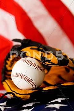 Baseball: ball in glove on flag Stock Photos
