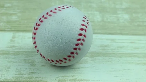 Baseball ball on a wooden Stock Footage 76597123