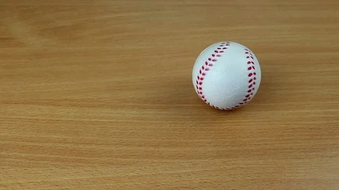 Baseball ball on a wooden table Stock Footage 76454133