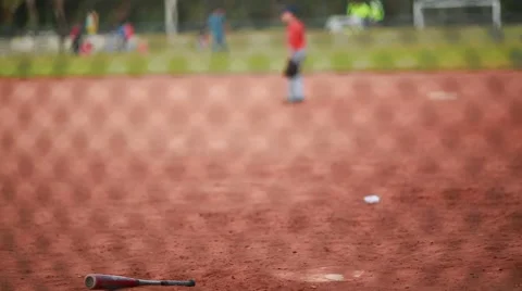 A Baseball Bat Laying down in the field Stock Footage 47709219