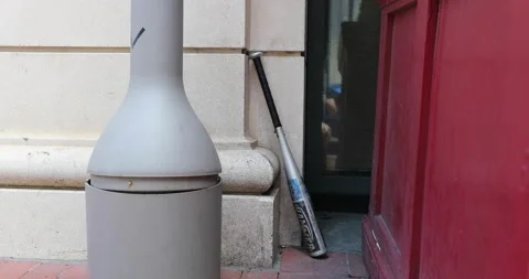 A baseball bat is left behind after looters raid stores in Washington, DC Stock Footage 131906554
