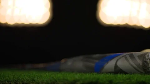 A baseball bat spins on a turntable under the lights. Stock Footage 72357701