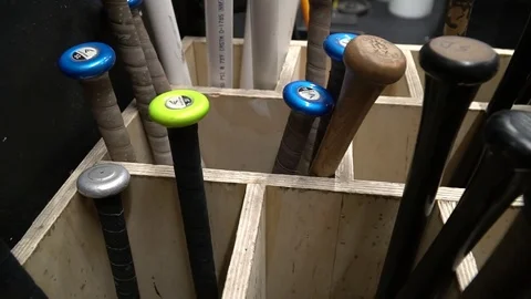 Baseball Bats in bat rack Vídeo Stock 77368446