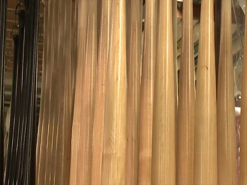 Baseball bats. Painted and finished. Hanging to dry C Stock Footage 102185087