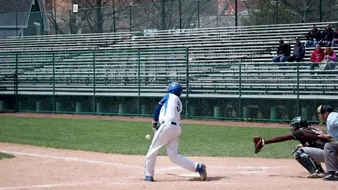 Baseball batter hits ball and runs to first Stock Footage 152827634