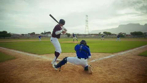 Baseball batter watches a pitch during a game Stock Footage 337698445