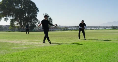Baseball being thrown, white male fielders sprinting, leaping, securing out with Stock Footage 339320324