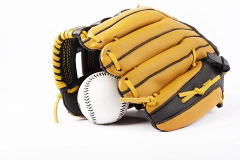 Baseball black and yellow gloves with ball isolated on white background. 库存照片