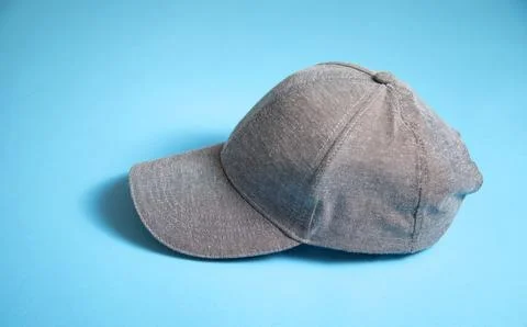 Baseball cap on the blue background. Stock Photos