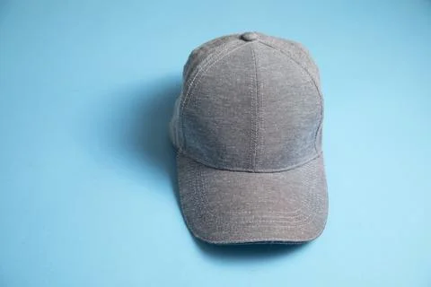 Baseball cap on the blue background. Stock Photos