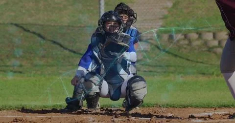 Baseball catcher in gear with data processing image over field background 스톡 사진