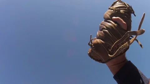 Baseball caught in brown leather glove Stock Footage 80357839