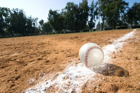Baseball on chalk line Stock Photos