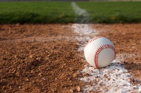 Baseball on the chalk line Stock Photos