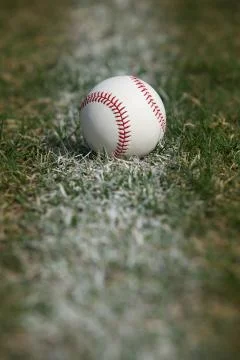 Baseball on the chalk line Stock Photos