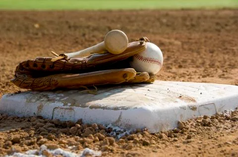 Baseball equipment on base Stock Photos