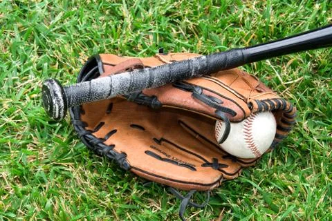 Baseball equipment on grass Stock Photos