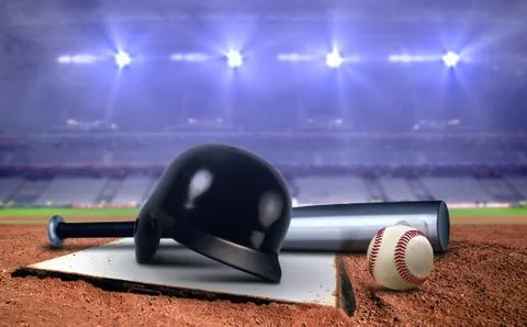 Baseball equipment in a stadium under spotlights Stock Photos