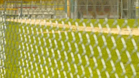Baseball Field Through Chain Link Fence SLIDE RIGHT SLOW MOTION Stock Footage 107389597