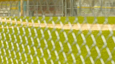 Baseball Field Through Chain Link Fence SLIDE RIGHT Stock Footage 107389758