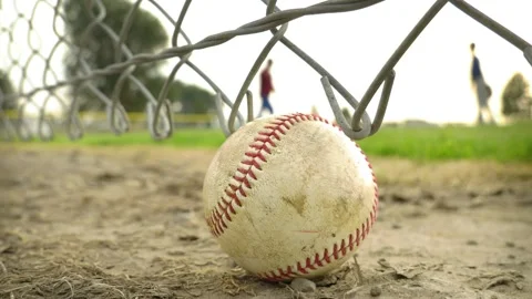 Baseball foreground with out of focus little league practice defocused in Stock Footage 147199721