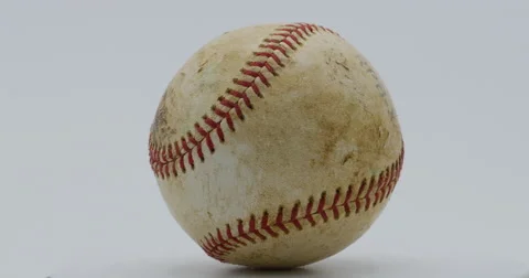 Baseball Game Ball Rotating Slowly Isolated on White 10bit, 4K Stock Footage 66194012