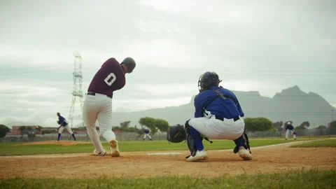 Baseball game: batter hits a pitch on the field Stock Footage 336363852