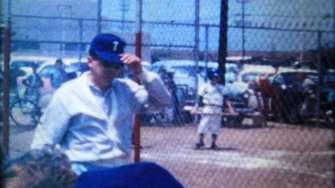 Baseball game with fans at neighborhood park 1950s vintage film home movie 4441 Stock Footage