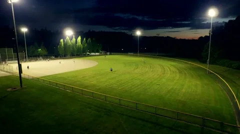 Baseball game on a field at a park in the evening Stock Footage 50301815