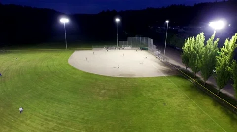 Baseball game on a field at a park in the evening Stock Footage 50302171