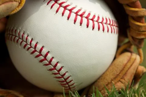 Baseball in a glove close up Stock Photos