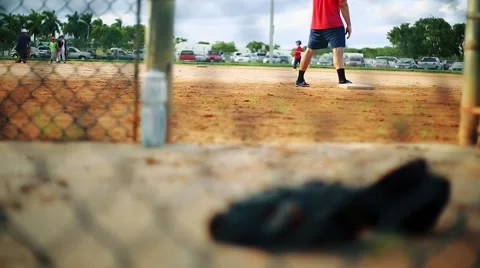 Baseball glove inside a dugout during practice Stock Footage 55022013