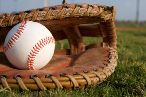Baseball in a glove Stock Photos