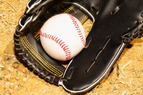 Baseball in glove Stock Photos