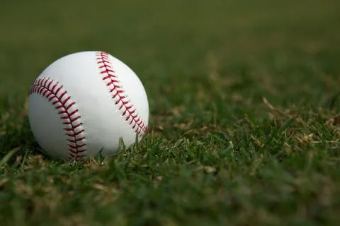 Baseball on the grass Stock Photos